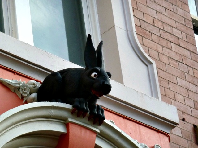 A sideways close up of the vampire rabbit over the back door of the cathedral buildings in Necastle