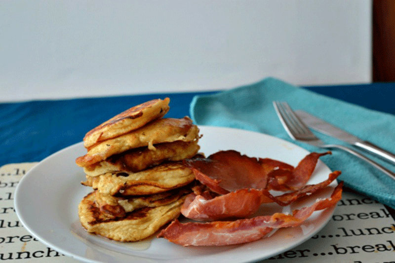 American style pancakes on a plate with bacon