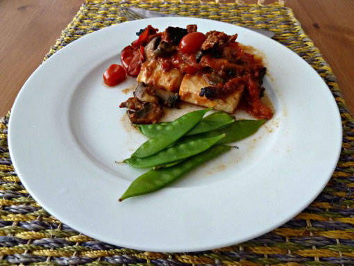 Cod baked with chrizo and tomatoes