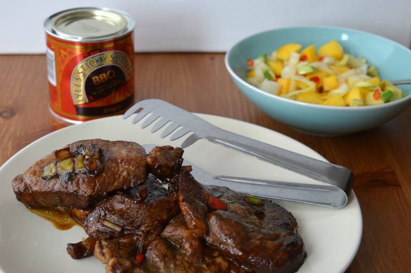 Pork chops marinated in black treacle with lime juice and spices