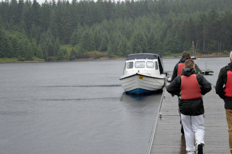 Boarding the motorboat for the osprey tour of kielder water