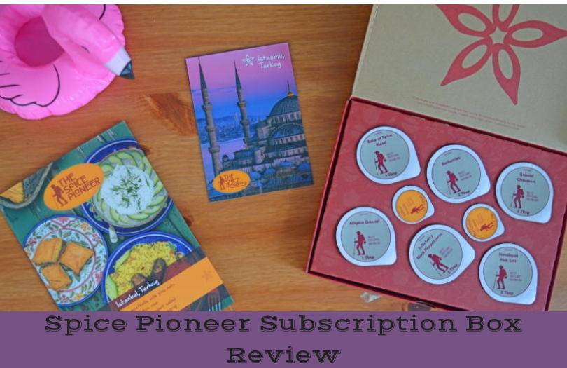 The contents of the spice pironeer subscription box shown on a wooden background