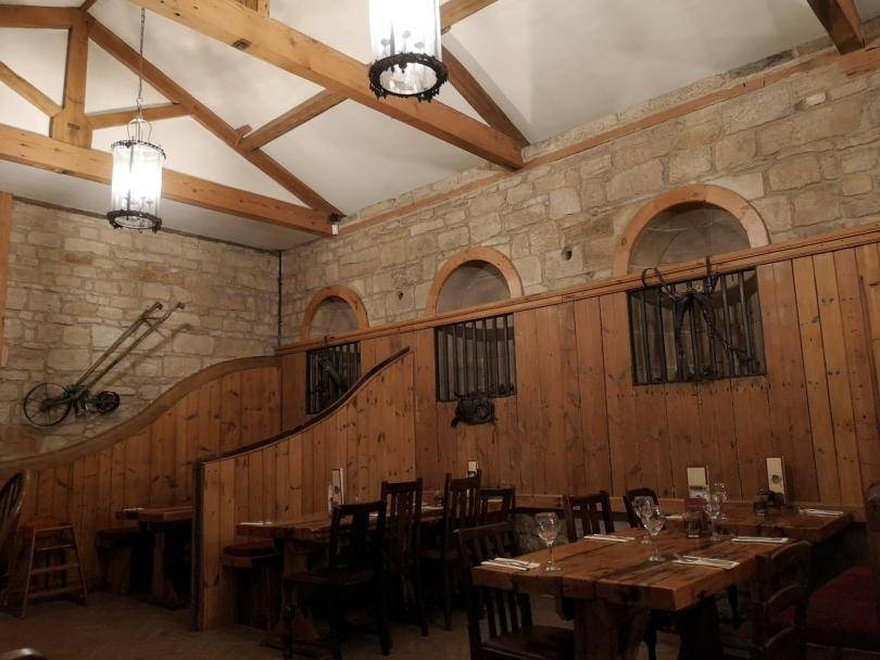 Inside Stables restaurant, the tables and overhead beams