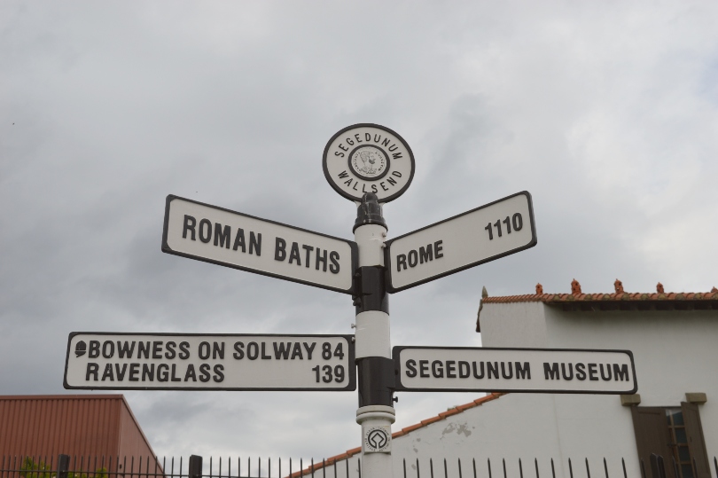 Signpost beside Segdumum Roman fort showing distance to Rome
