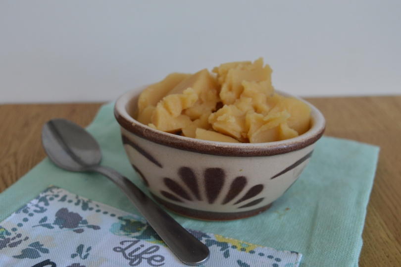 Pease pudding in a bowl on a green cloth
