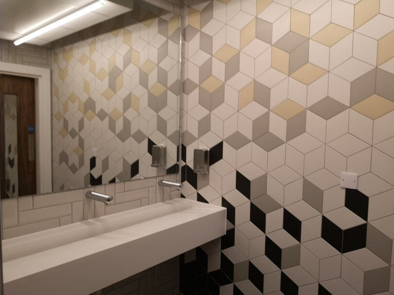 The gym changing rooms with tiled walls