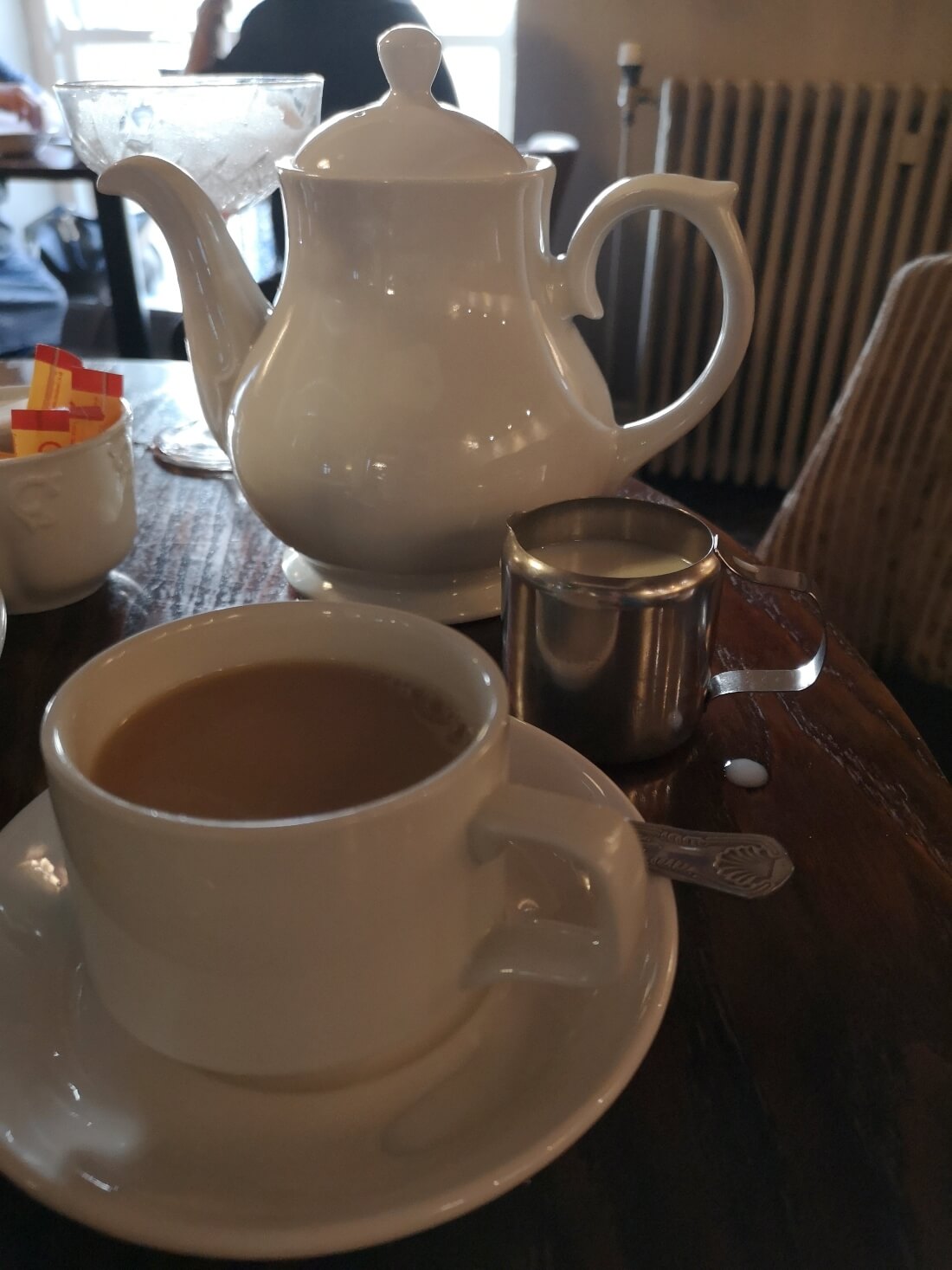 teapot and cup of tea on a table