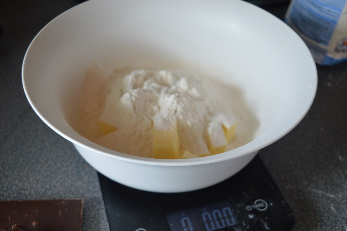 Flour and butter in a bowl on some scales
