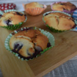 Blueberry muffins on a board