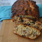 banana and walnut bread, sliced on a chopping board