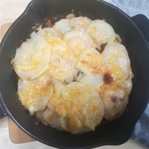 Pan Haggerty recipe with golden crispy base in cast iron pan