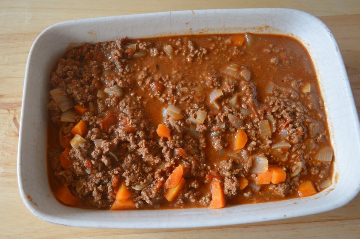 Cottage pie filling in an ovenproof dish ready for mashed potato