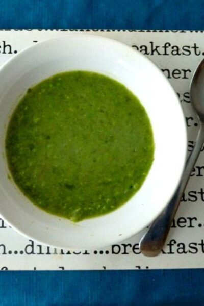 Pea and lettuce soup in a bowl on a table