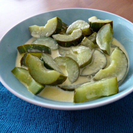 Cucumbers braised in butter and cooked in a orange sauce.