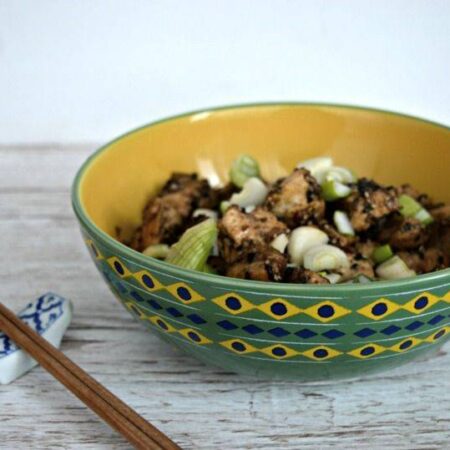 Sesame Chicken in a bowl with chopsticks