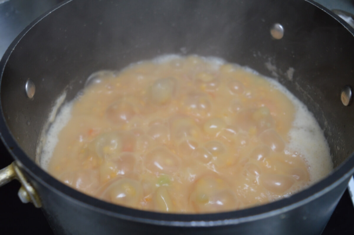 Lentil soup simmering until thick