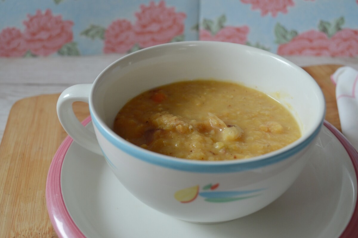 A bowl of thick ham and lentil soup