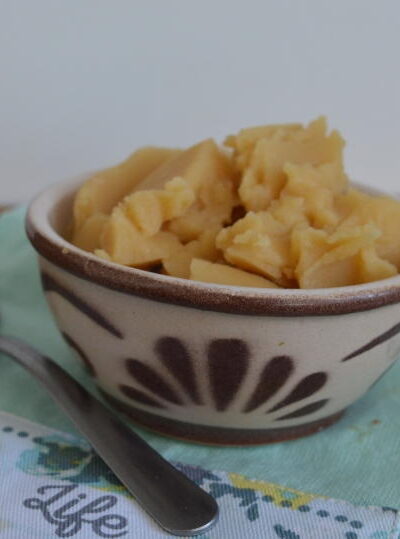 Pease pudding in a bowl on a green cloth