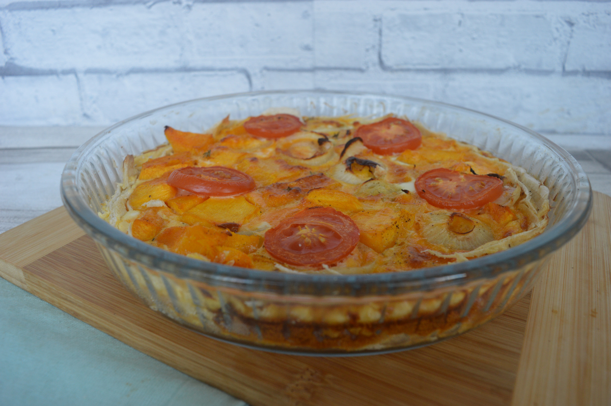 Pumpkin and onion quiche on a table