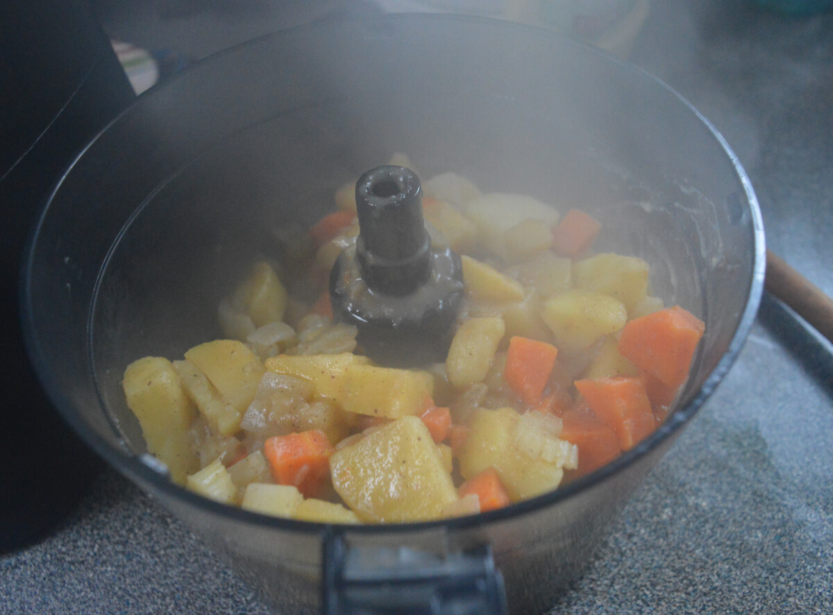 Cooked vegetables in a food processor