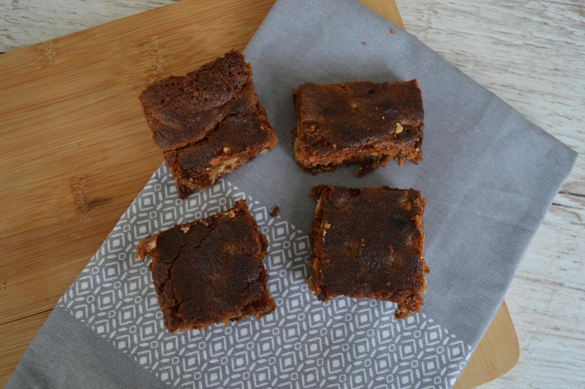 Food for the gods, date and walnut bars on a napkin seen from above.