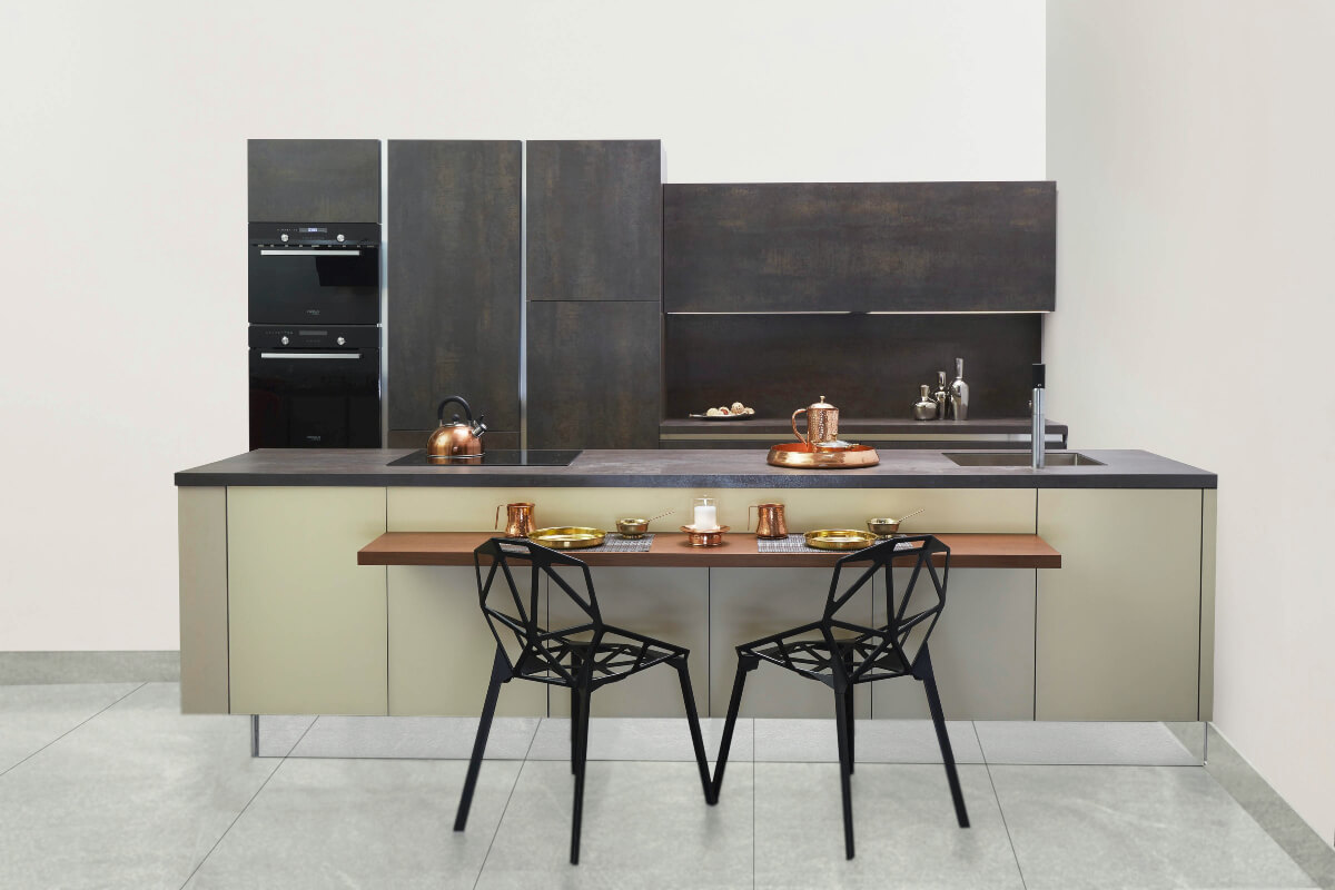 two black chairs in front of breakfast bar in kitchen