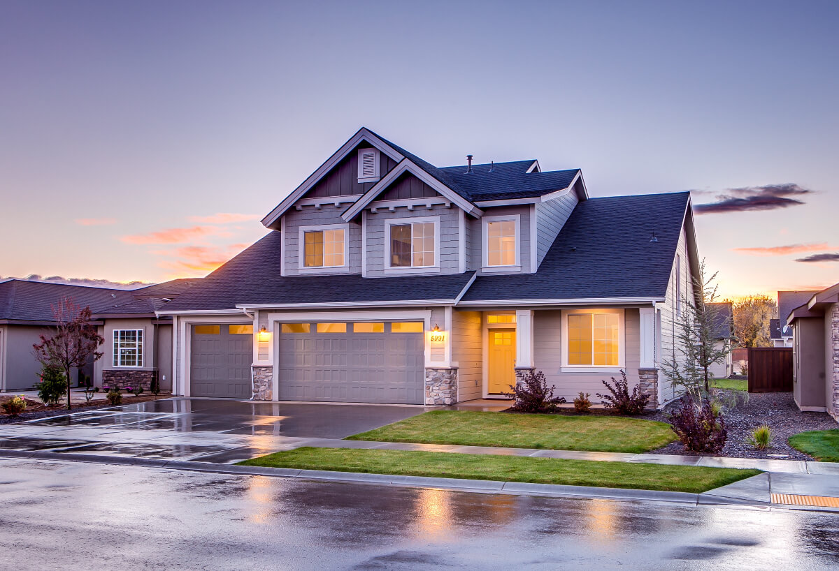 Blue and grey concrete house at twilight