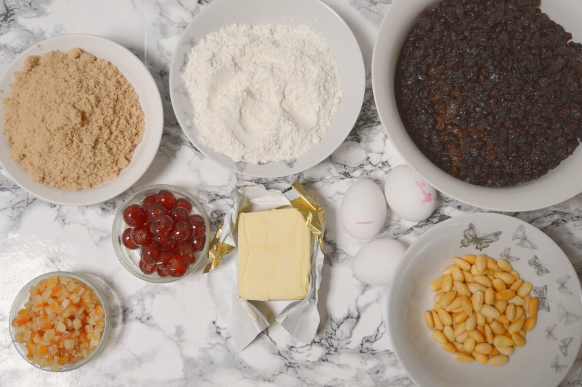 Ingredients for a Christmas cake laid out on a table