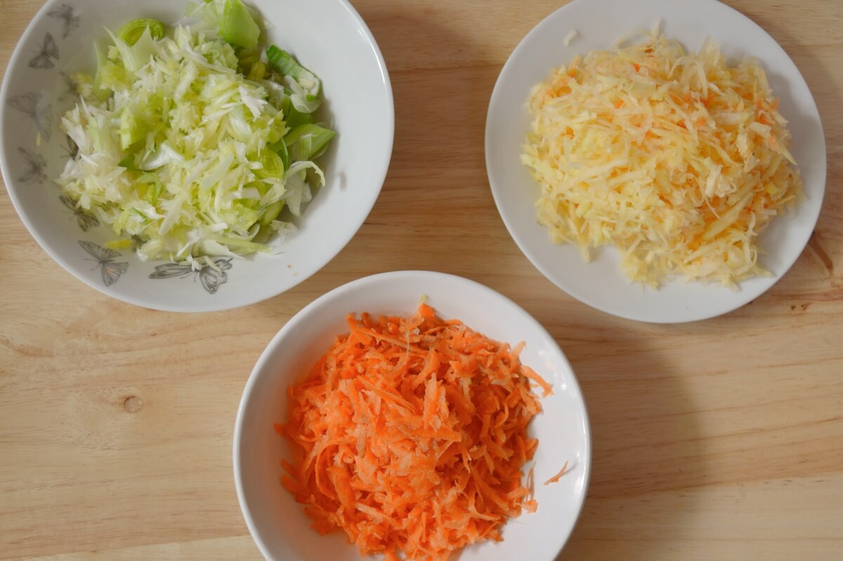 Grated carrots, swede and leek ready to add to the broth.