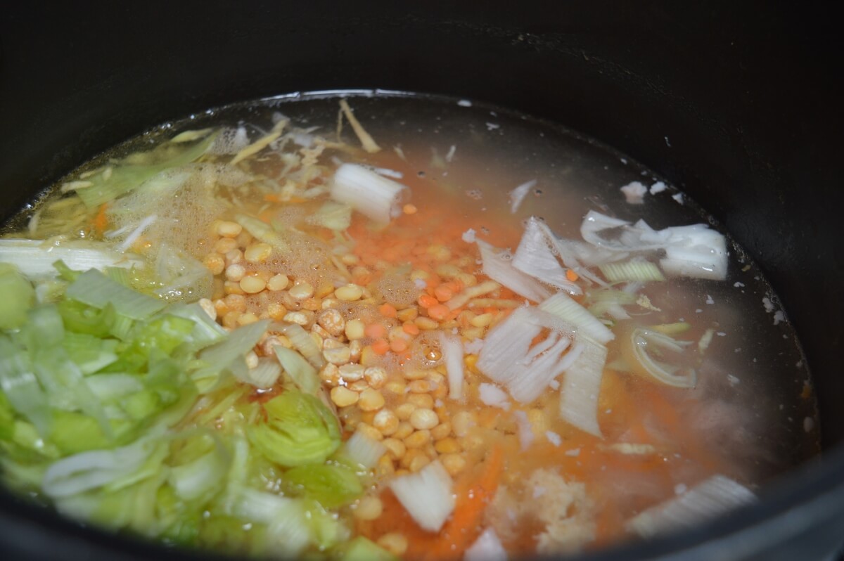 Red lentils and yellow split peas added to the broth.