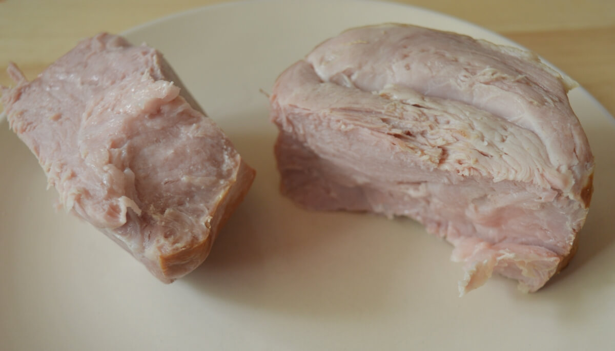Cooked gammon removed from the stock after simmering.