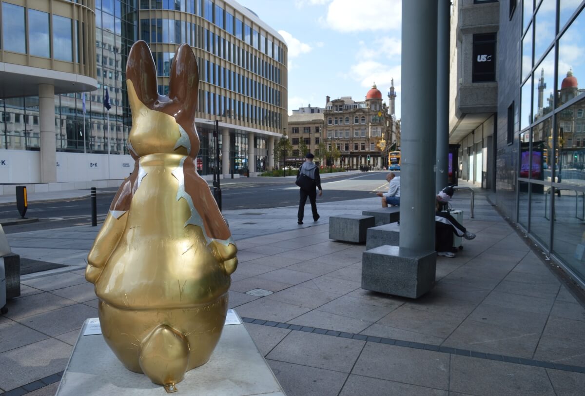 Back of Choc Peter Rabbit showing his gold chocolate wrapper outside Newcastle City Library