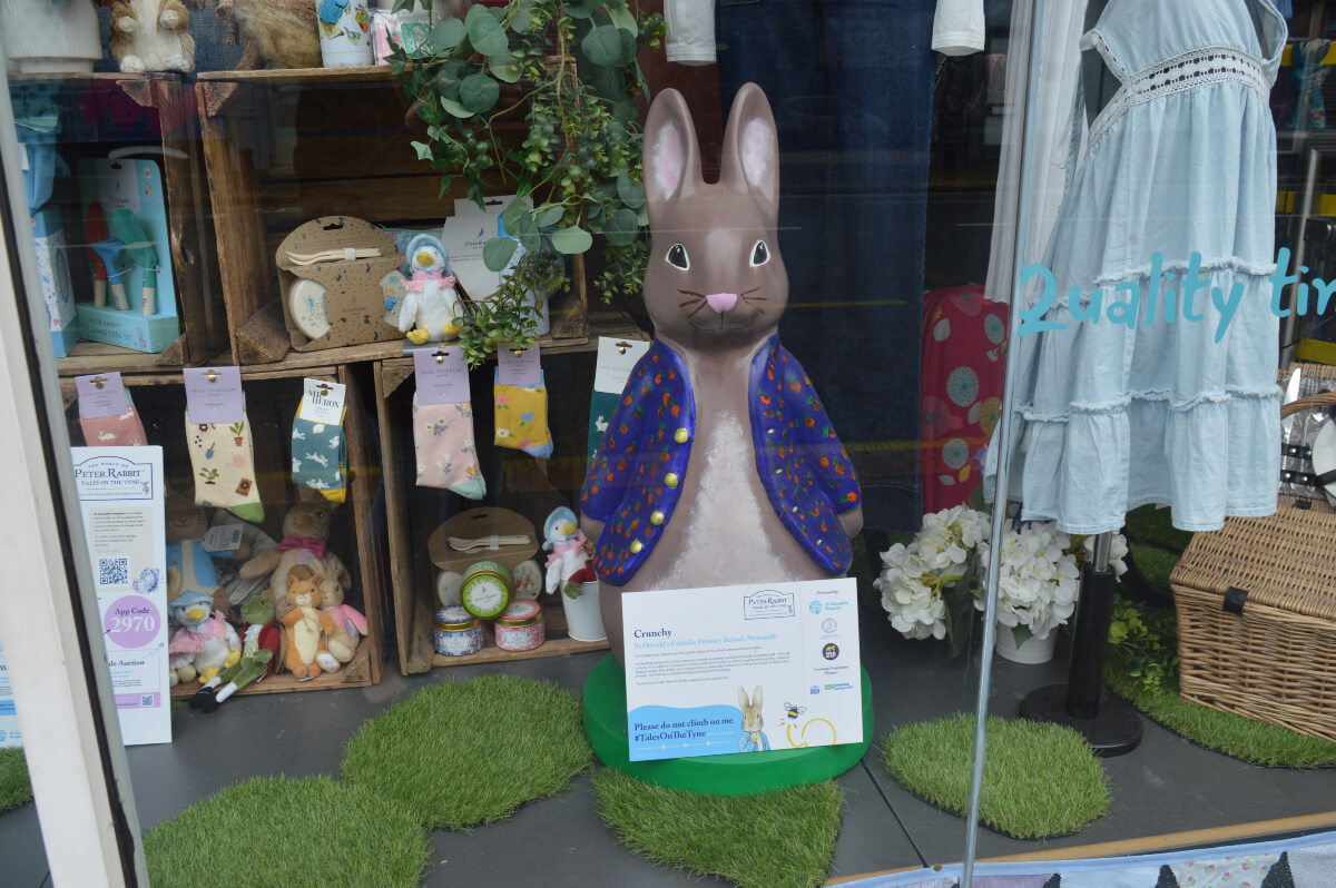 Crunchy Peter Rabbit with a blue jacket covered in colourful carrots