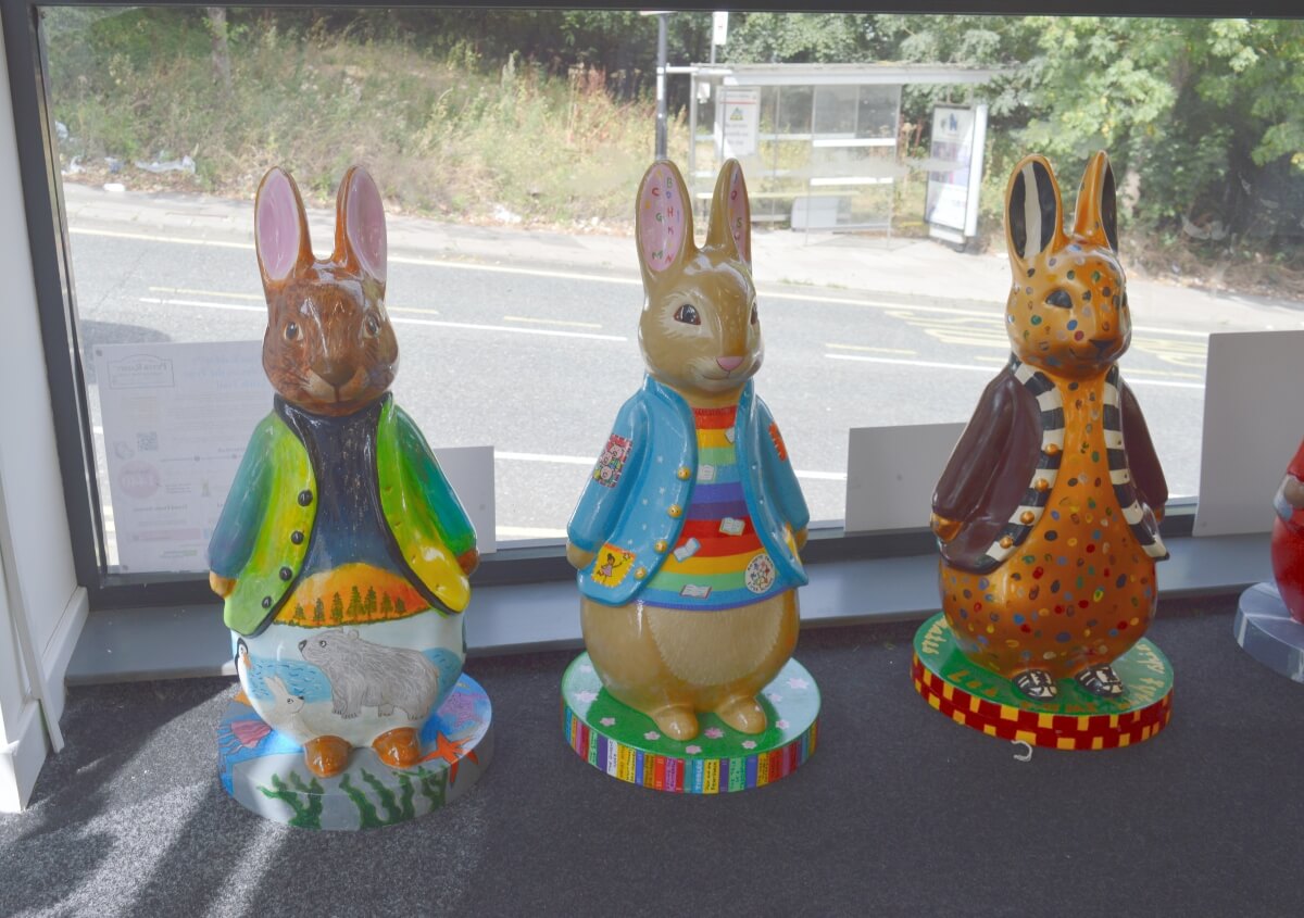 Three colourful Peter Rabbit fluffles displayed together at Peter Rabbit Trail HQ in Ouseburn