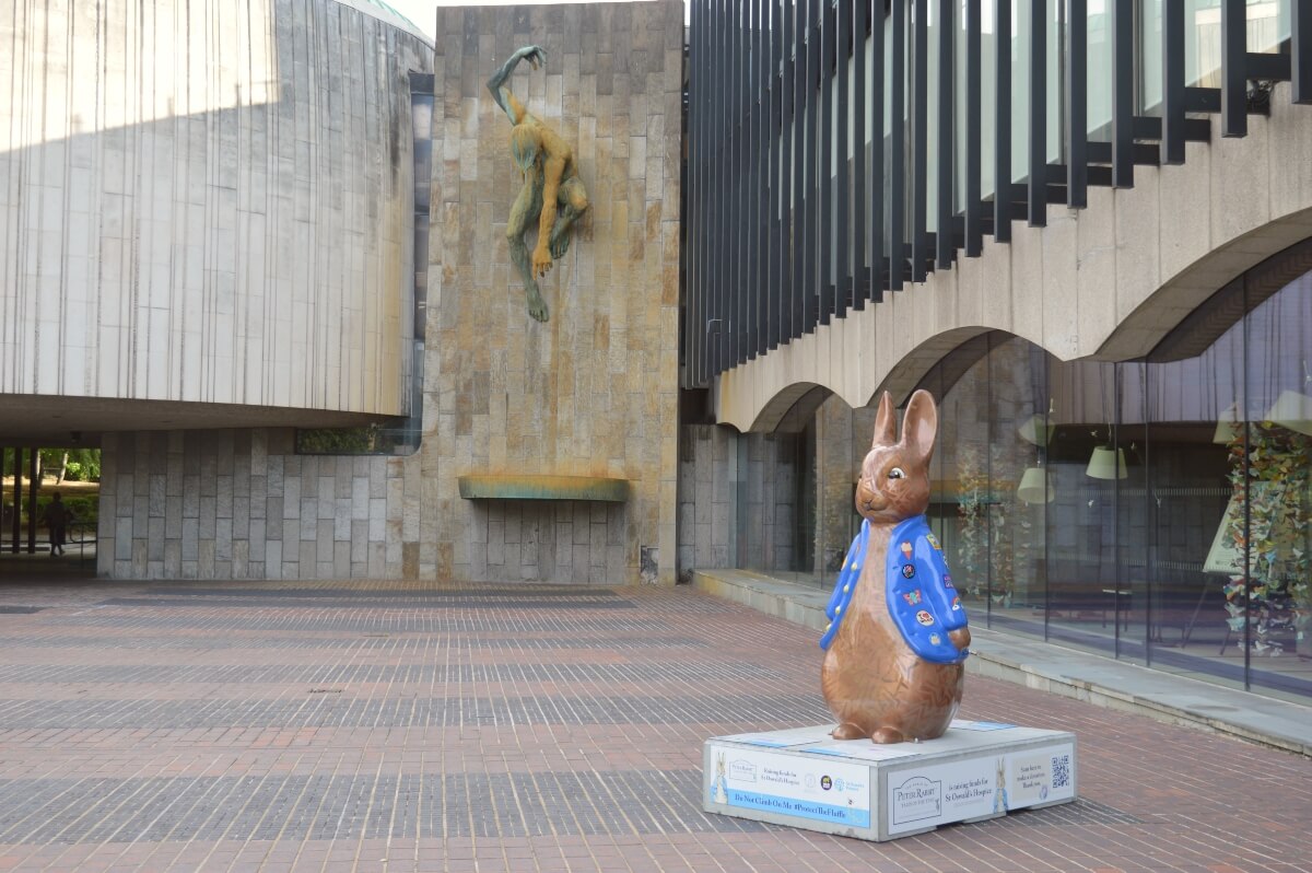 Golden Peter Rabbit sculpture with River God Tyne at Newcastle Civic Centre