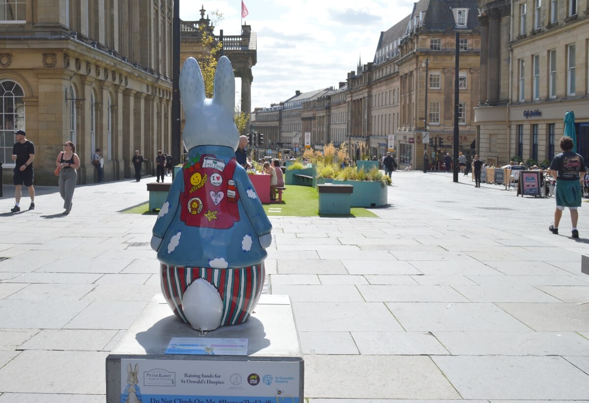 Back of Hopping to Get On Board Peter Rabbit looking down Grey Street in Newcastle