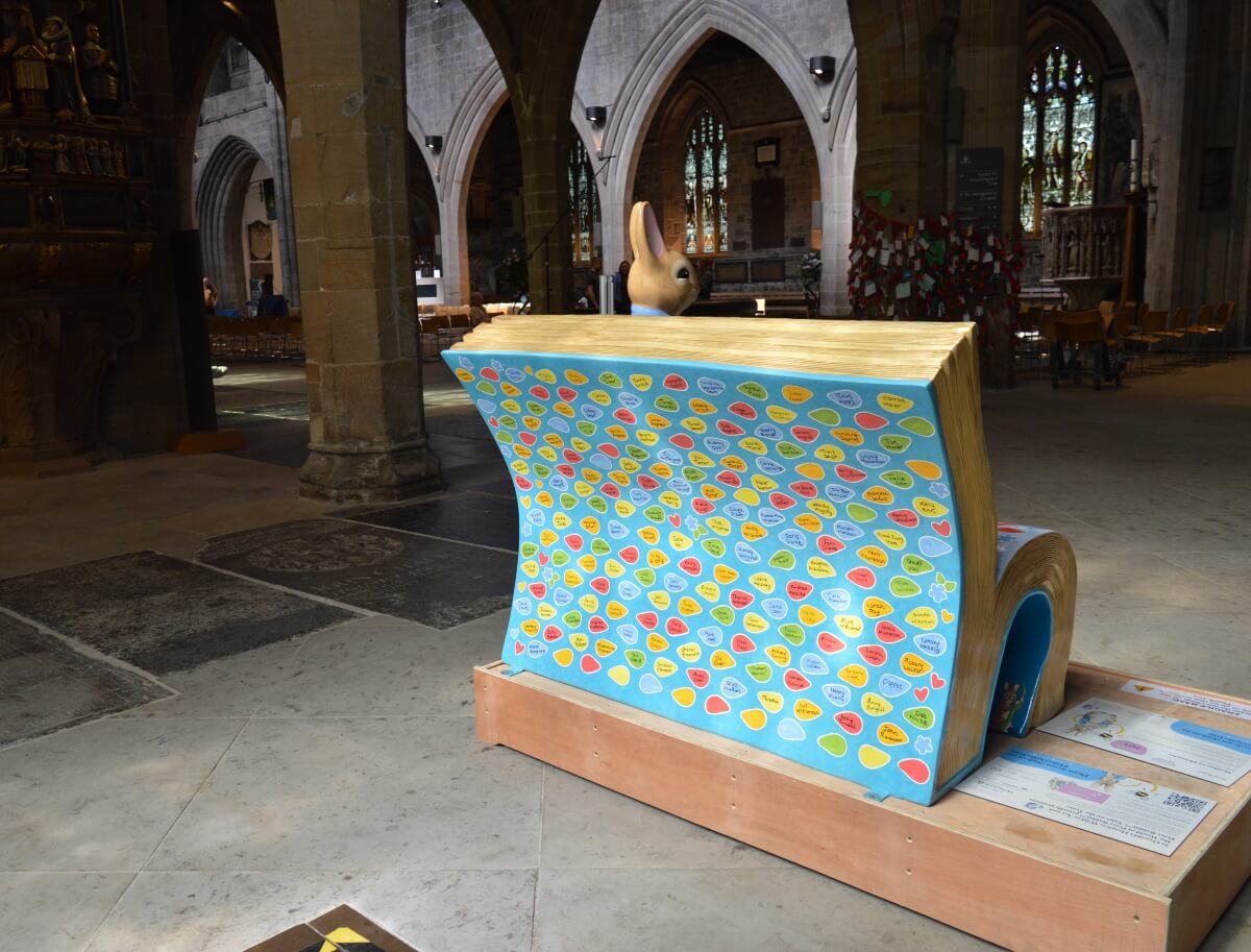 Back of Meadow of Memories bench covered with colourful named leaves in Newcastle Cathedral