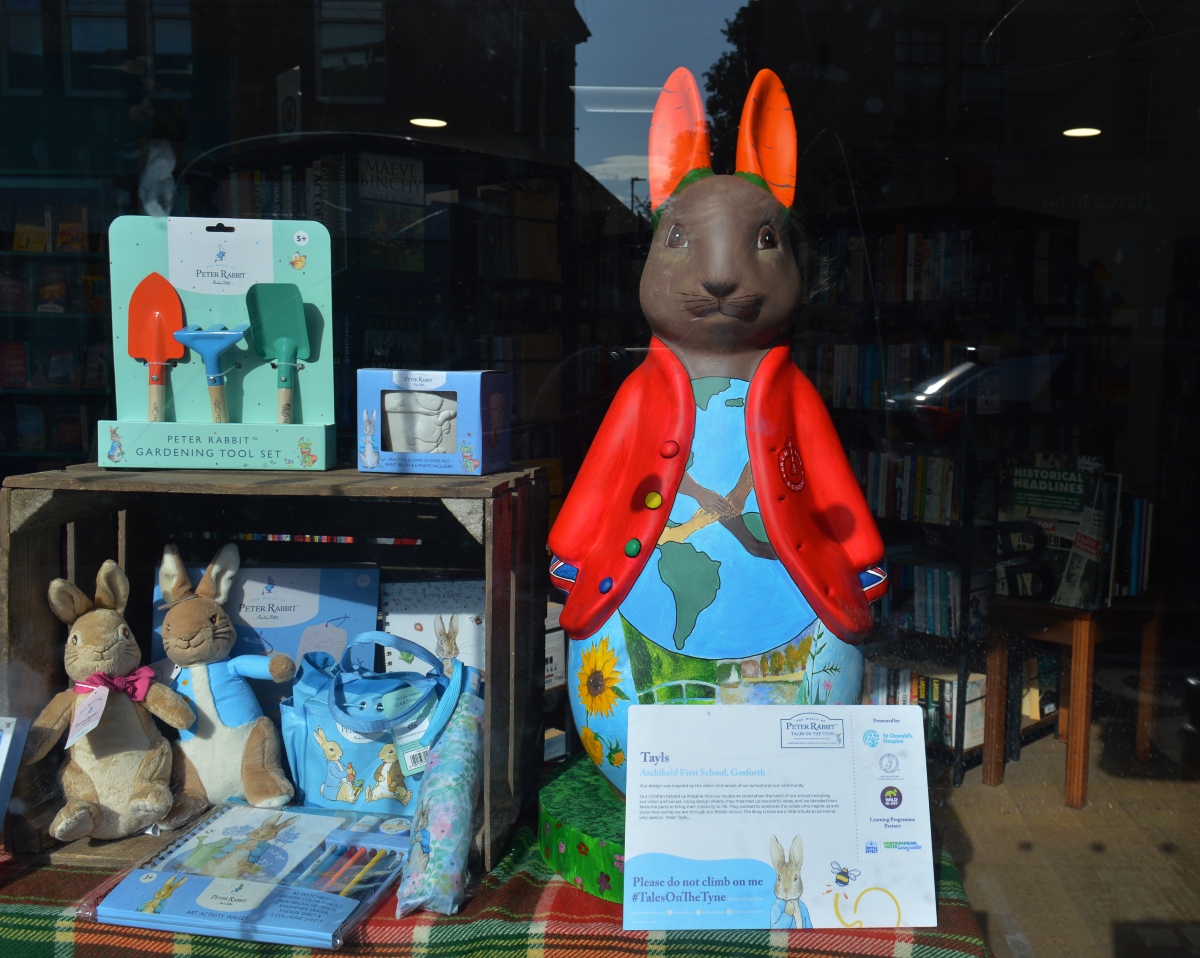 Tayls Peter Rabbit fluffle by Archibald First School in the window of St Oswald's Hospice Shop Gosforth