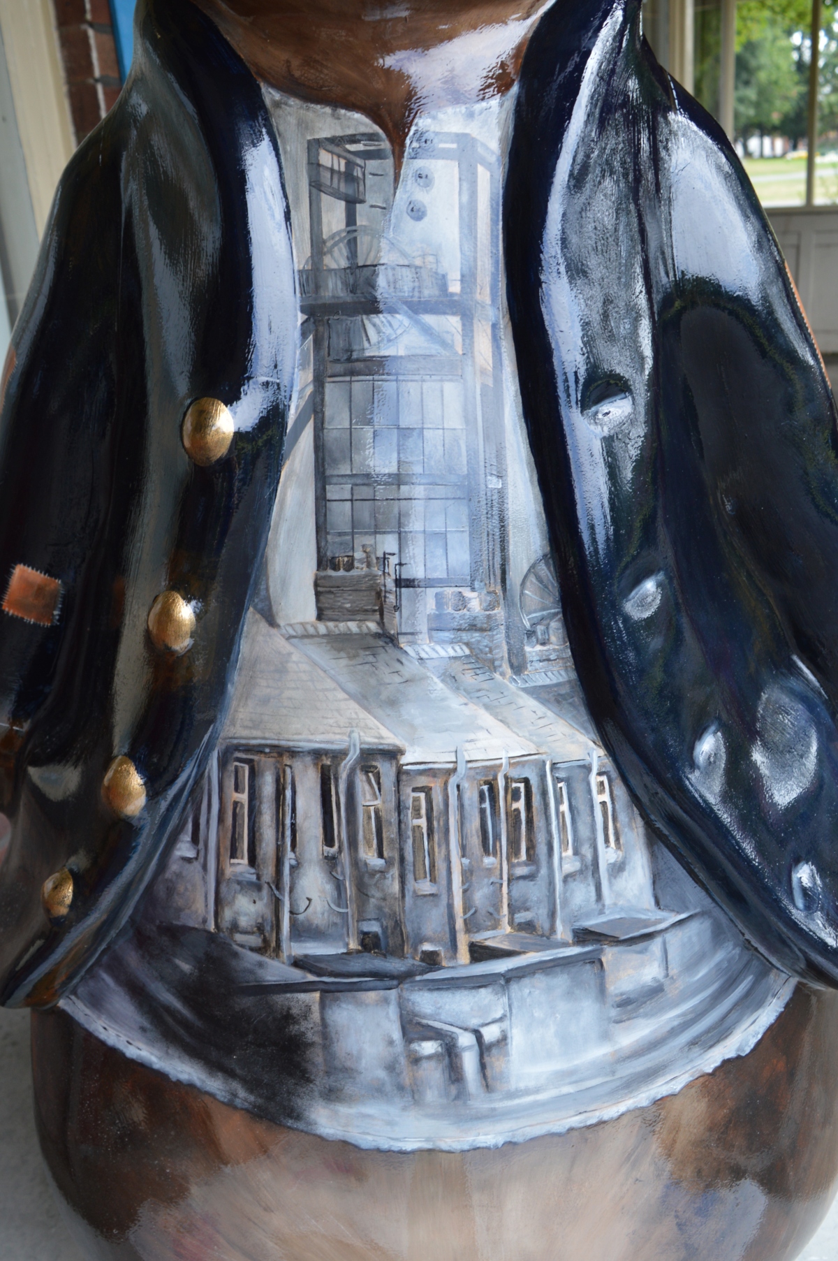 Close-up of the painted mining details on Peter of the Pit sculpture.