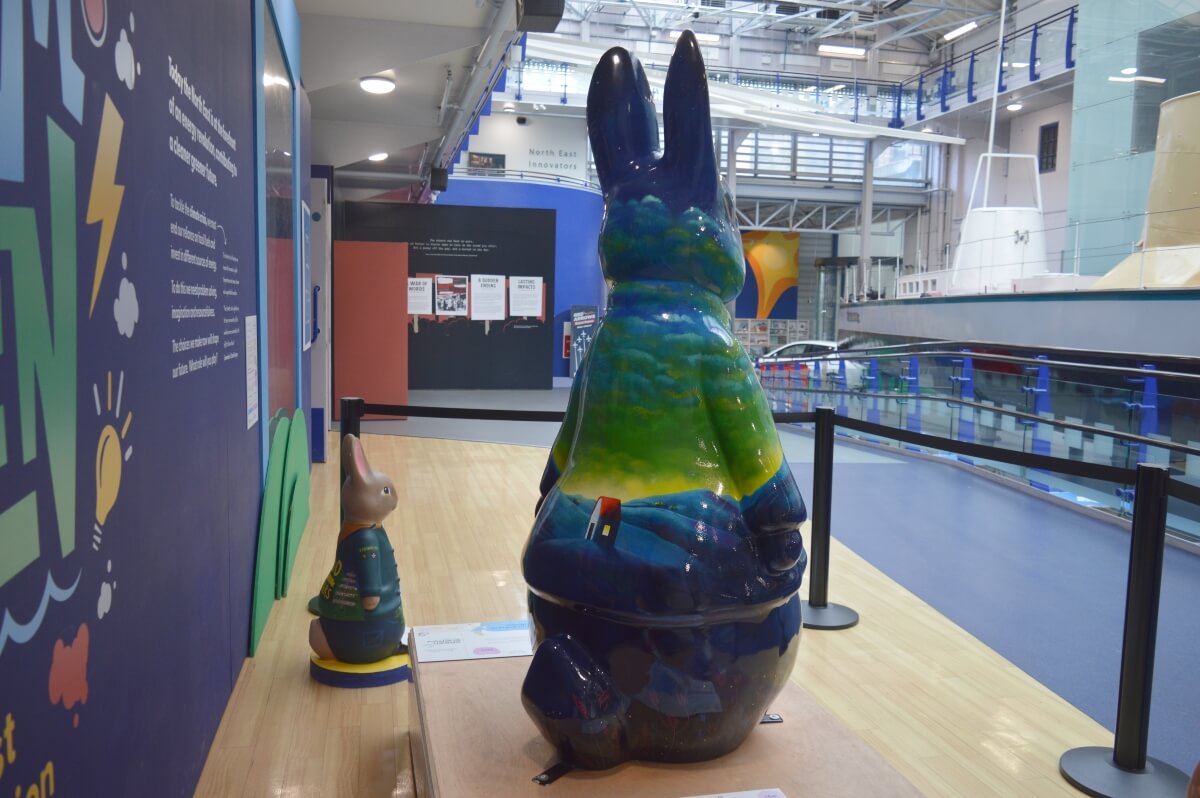 Side view of The Dream Peter Rabbit sculpture at the Discovery Museum