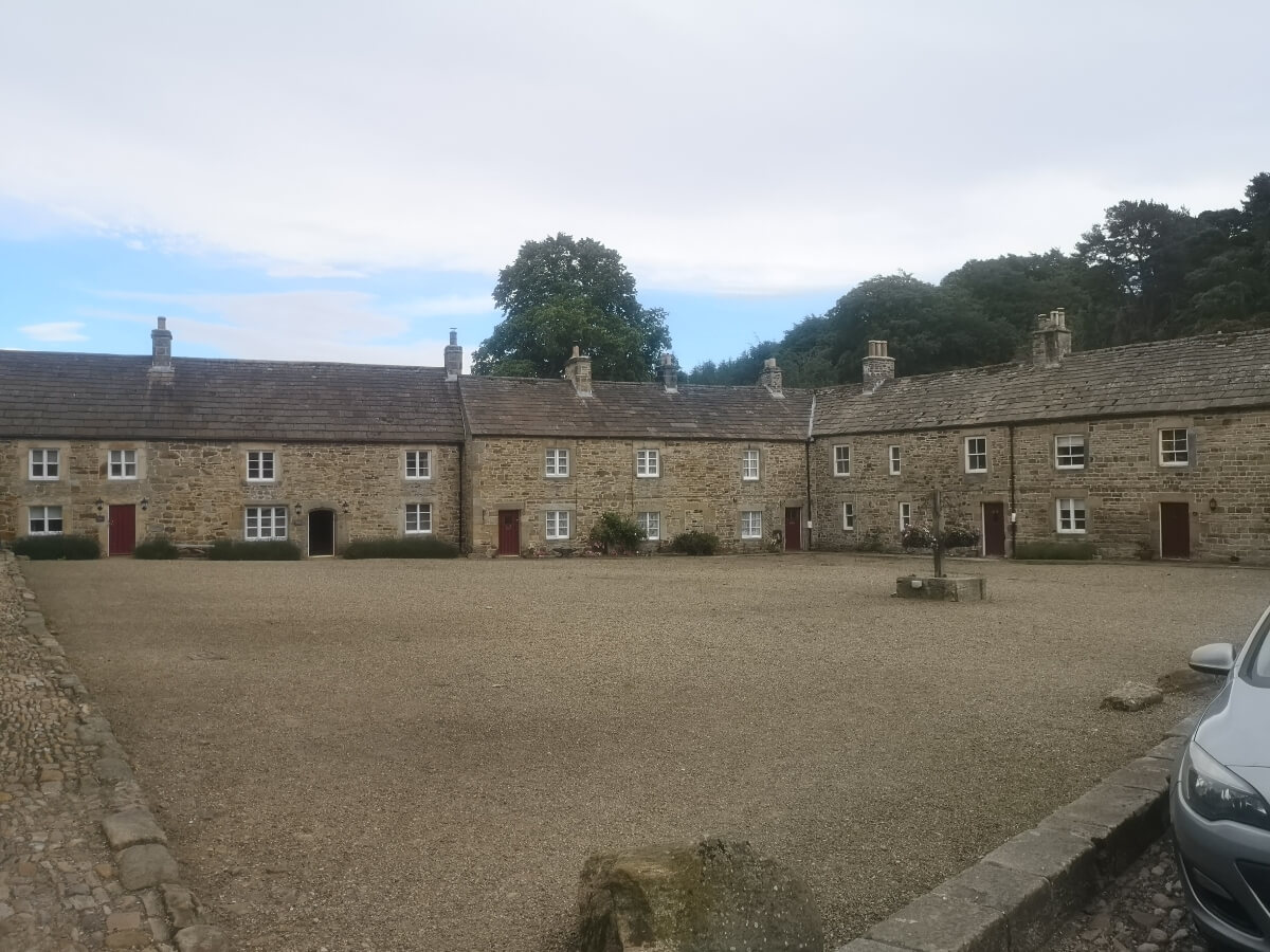 Stone houses around the village square in Blanchland, Northumberland