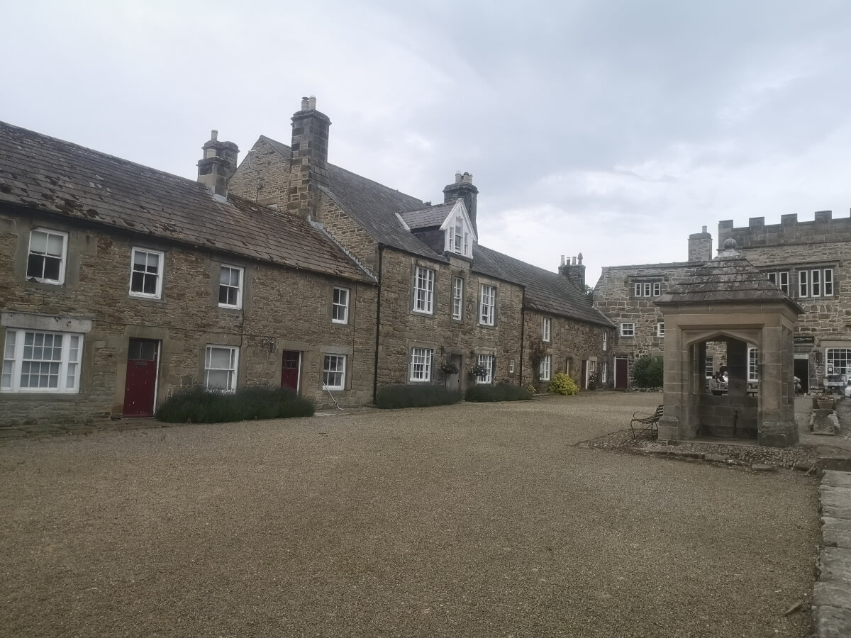 Blanchland village square surrounded by historic stone buildings