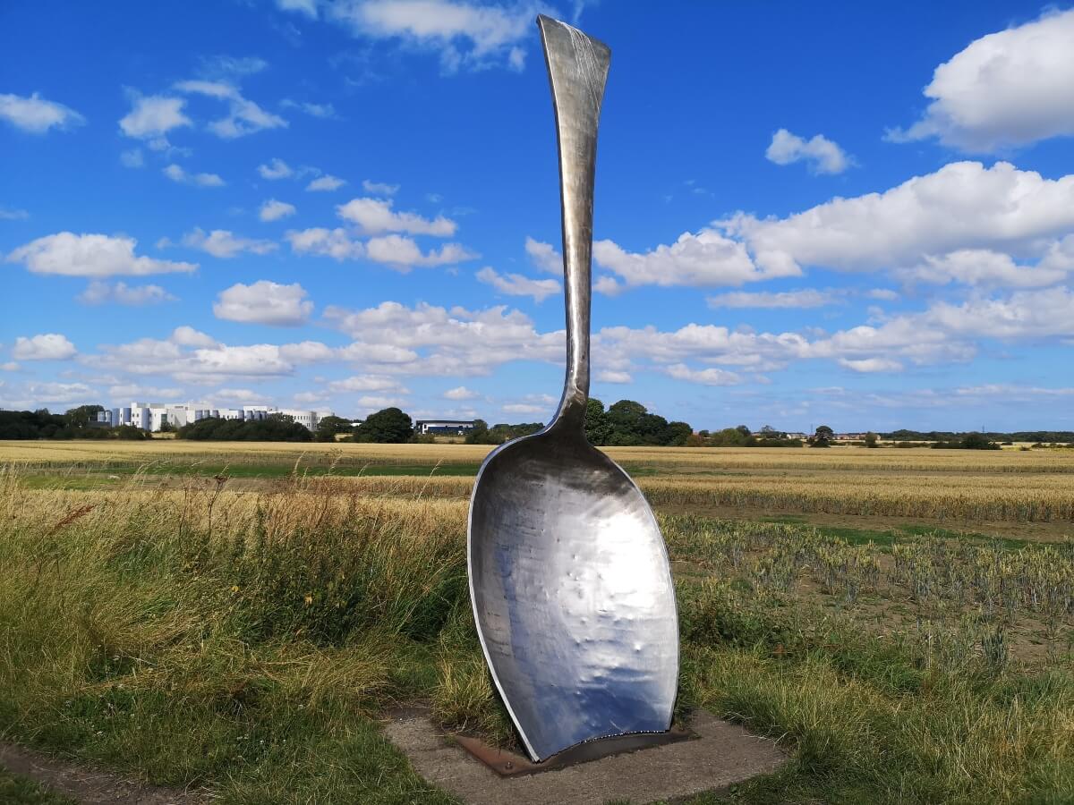 Giant Spoon sculpture standing in a field near Cramlington, Northumberland.